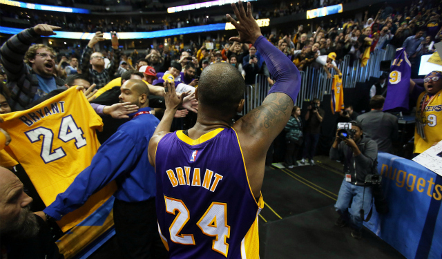 Dec 22, 2015; Denver, CO, USA; Los Angeles Lakers forward Kobe Bryant (24) waves to the crowd as he exits the floor after the game against the Denver Nuggets at Pepsi Center. The Lakers won 111-107. Mandatory Credit: Chris Humphreys-USA TODAY Sports