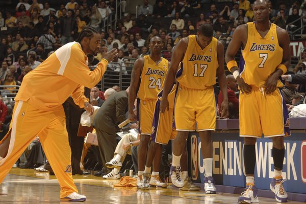 LOS ANGELES, CA - NOVEMBER 3: Ronny Turiaf #21 of the Los Angeles Lakers encourages his teammates Lamar Odom #7, Andrew Bynum #17 and Kobe Bryant #24 before they enter the game against the Seattle Supersonics on November 3, 2006 at Staples Center in Los Angeles, California. NOTE TO USER: User expressly acknowledges and agrees that, by downloading and/or using this Photograph, user is consenting to the terms and conditions of the Getty Images License Agreement. Mandatory Copyright Notice: Copyright 2006 NBAE (Photo by Noah Graham/NBAE via Getty Images) *** Local Caption *** Ronny Turiaf;Lamar Odom;Andrew Bynum;Kobe Bryant