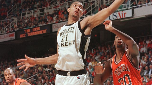 8 Mar 1996: Tim Duncan of the Wake Forest Demon Deacons lays the ball up as Chris Alexander #30 of the Virginia Cavaliers looks on in the quarterfinals of the ACC Tournament at the Greensboro Coliseum in Greensboro, North Carolina. Mandatory Credit: Doug